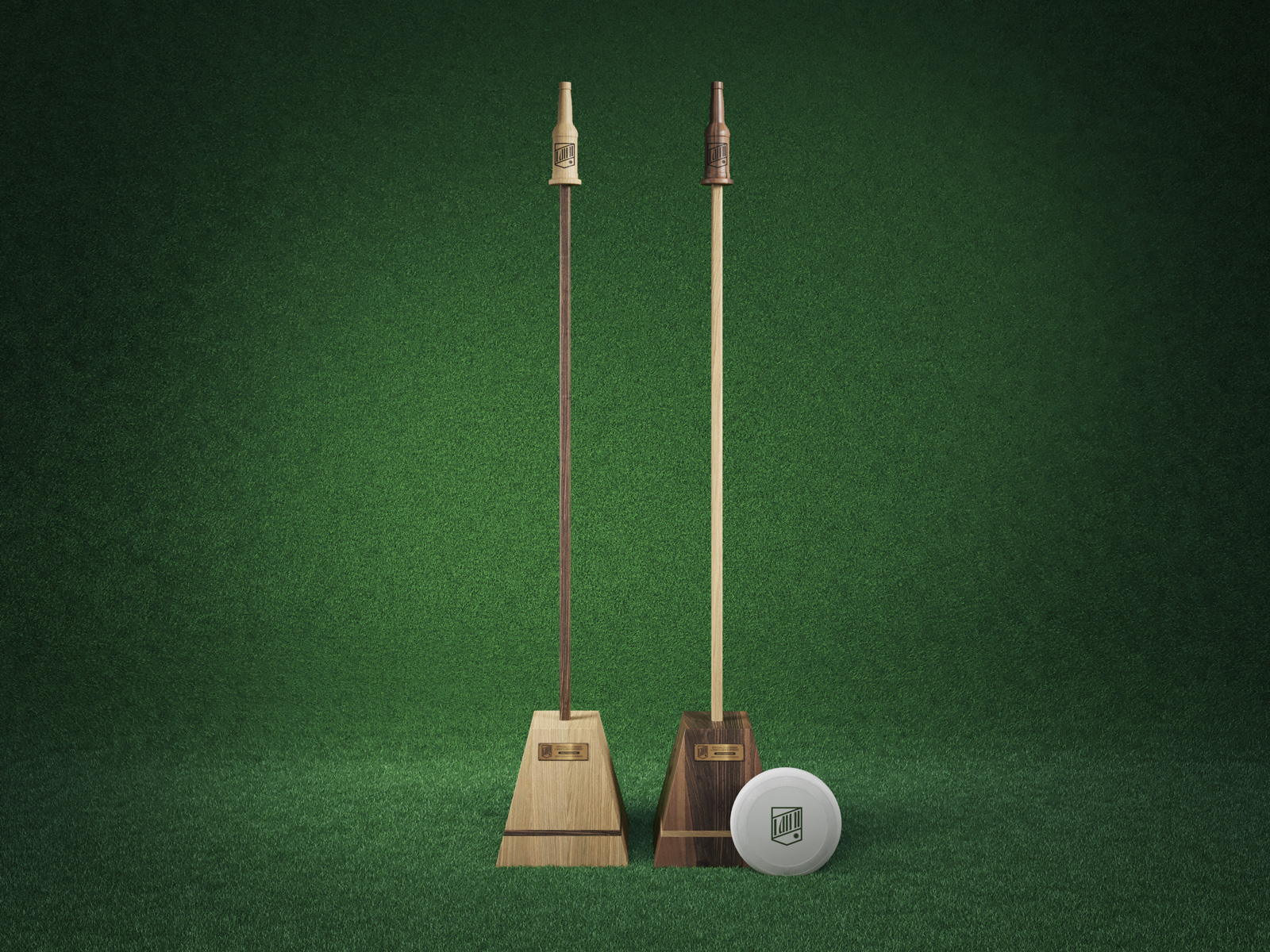 A set of gaming of equipment for the game beersbee, made of rich dark and light wood, set against a green turf background.