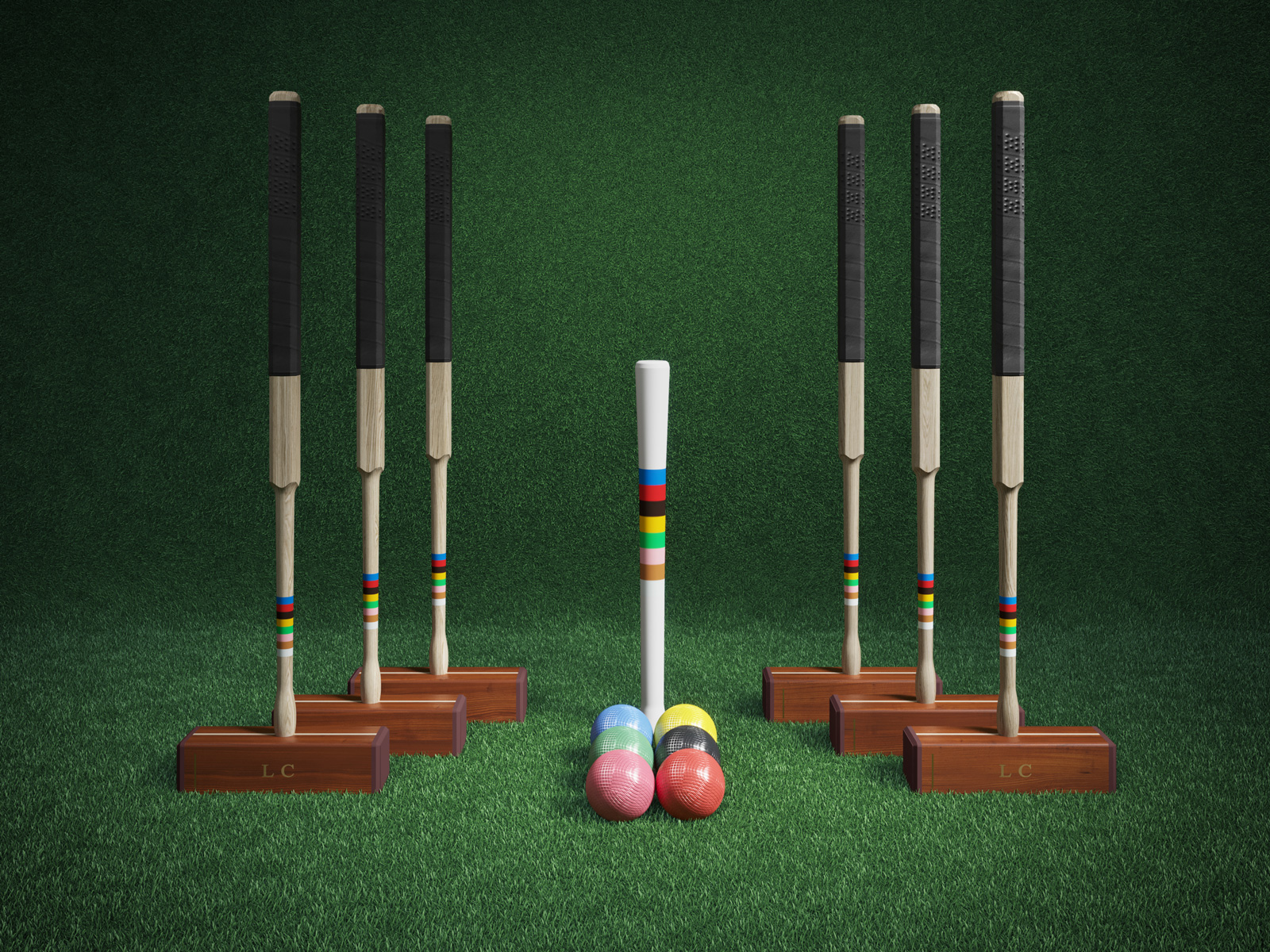 A set of gaming of equipment for the game croquet, made of rich dark and light wood, set against a green turf background.